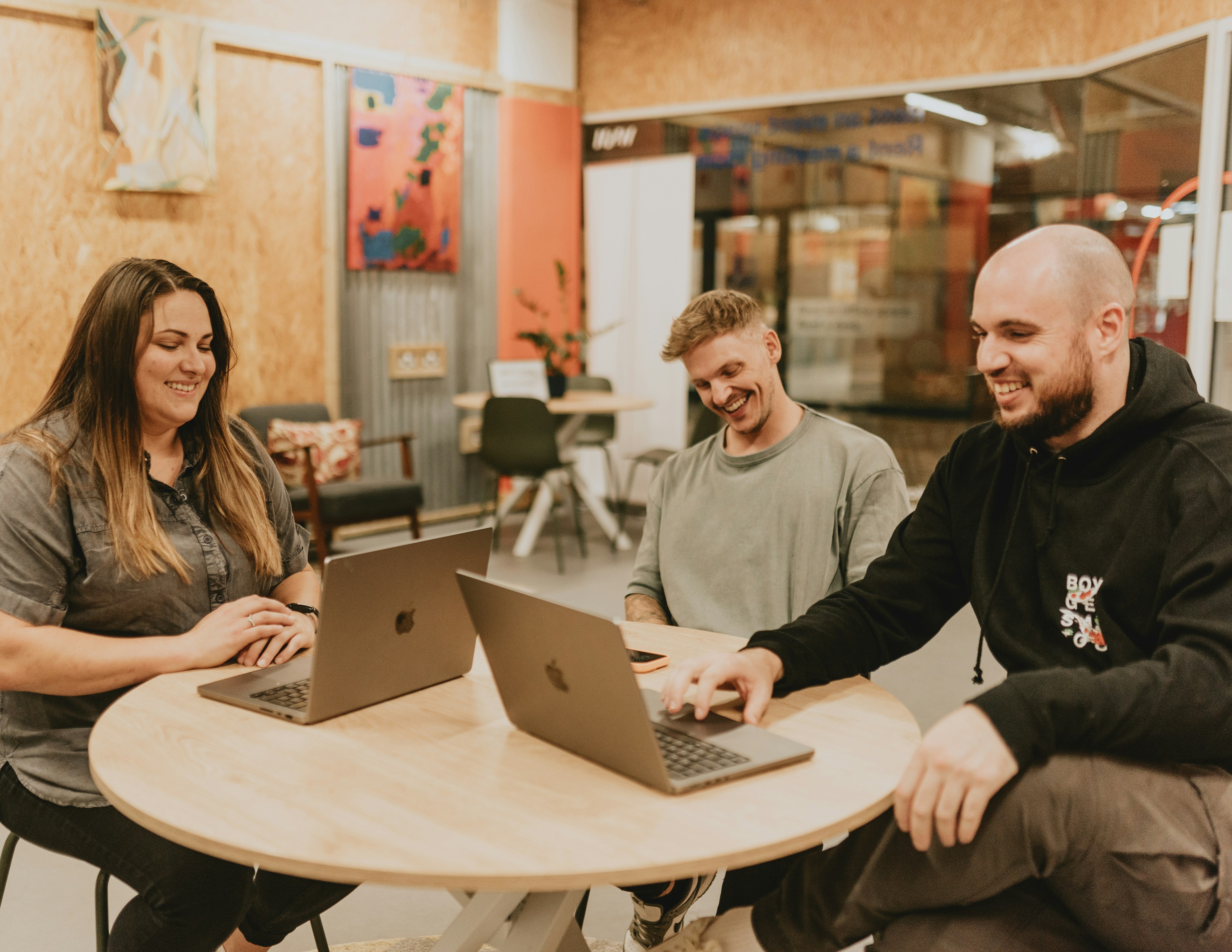 Team working together on laptops in an office